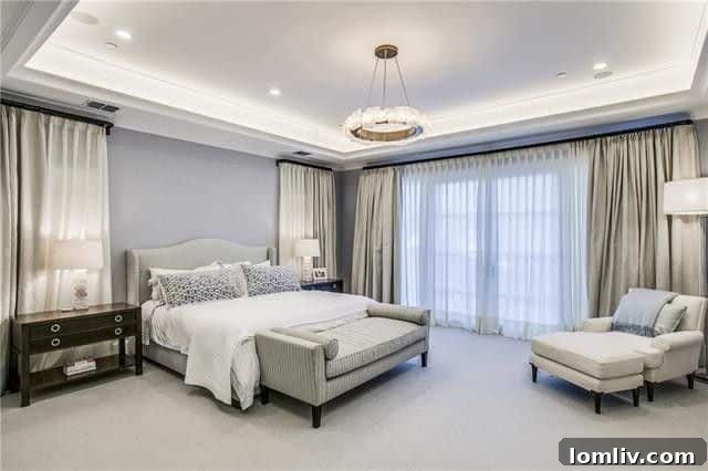 A well-appointed bedroom with luxurious textiles and comfortable ambiance at 3414 Beverly Drive