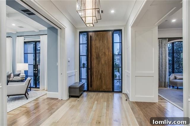 Elegant living room interior with a fireplace and luxurious furnishings at 3414 Beverly Drive