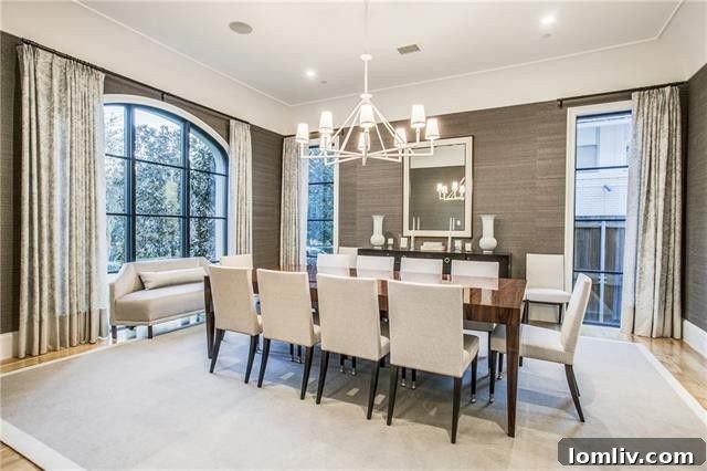 Formal dining area showcasing elegant design and ample natural light at 3414 Beverly Drive