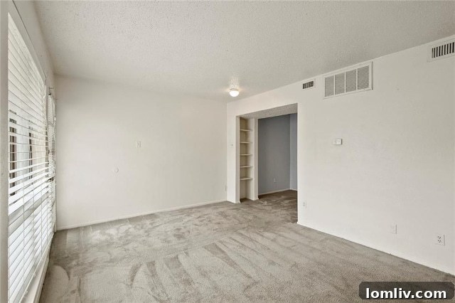 Stairs leading to the private master suite with balcony access in Turtle Creek Terrace Unit #168.
