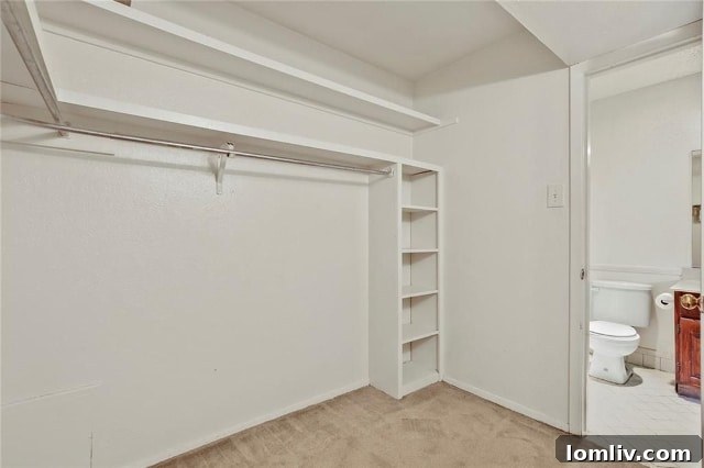 Shockingly large walk-in closet in the master suite of an Uptown Dallas condo, offering abundant storage.