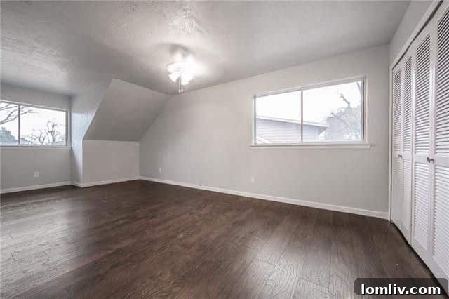 Spacious Master Bedroom with Wood Floors