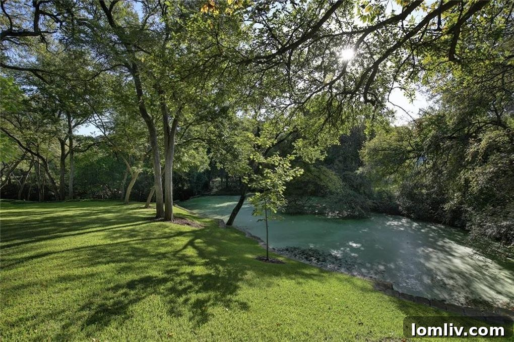 Manicured lawn overlooking natural creek