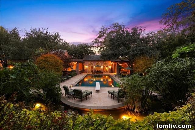 Panoramic exterior shot showcasing the expansive grounds and the grand scale of the luxury estate at 4001 West Lawther Drive.