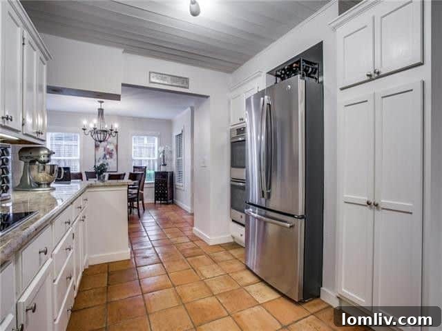 Granite countertops and contemporary fixtures in the updated kitchen