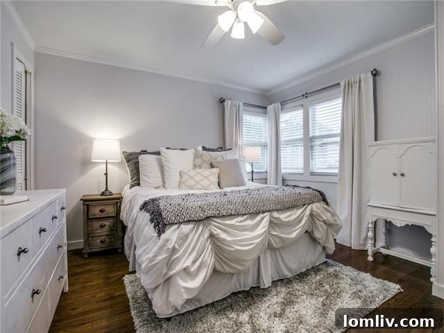 Cozy bedroom with ample natural light, ideal for relaxation