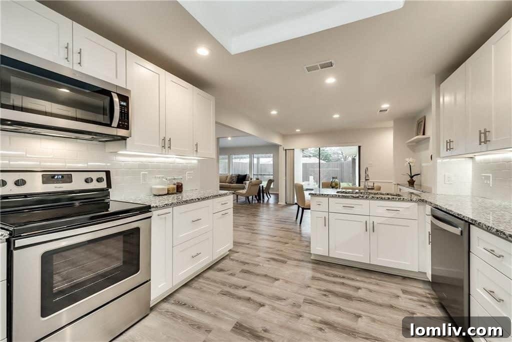 Luxurious Kitchen with Granite and Shaker Cabinets