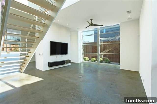 Catch Four Must See Houses This Weekend 19 Sleek, modern living area with abundant natural light