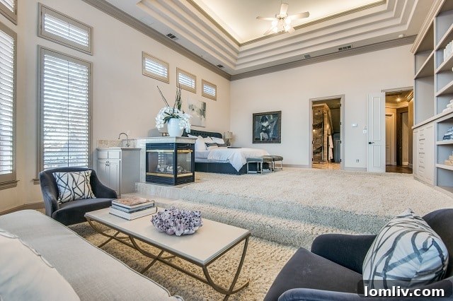 Master Bedroom with Built-in Shelving and Lounge Area