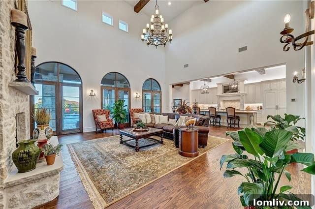 Gourmet kitchen with white custom cabinetry, large island, and modern appliances