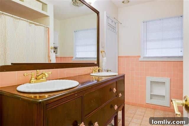 Detail of the unique pink tile work in the guest bathroom, a nod to vintage design.