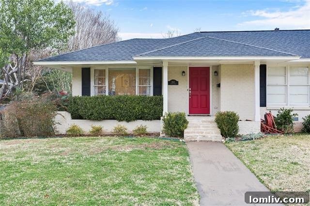 The charming red front door and classic shutters of 3957 Gaspar Drive in Midway Hollow.