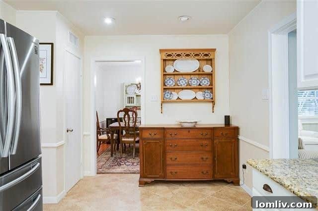 Dining room adjacent to the kitchen, perfect for entertaining or family meals.