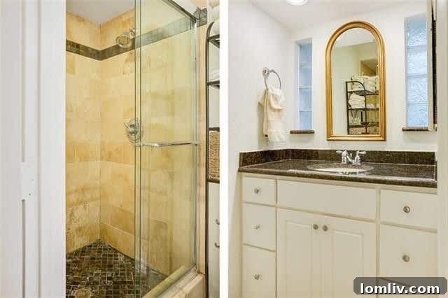 Updated master bathroom with contemporary fixtures and finishes.