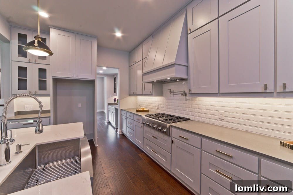 Gourmet Kitchen with White Quartz Counters and Stainless Steel Appliances