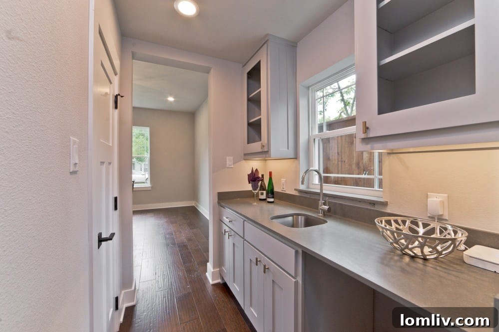 Walk-in Pantry and Catering Prep Area with Sink and Cabinets