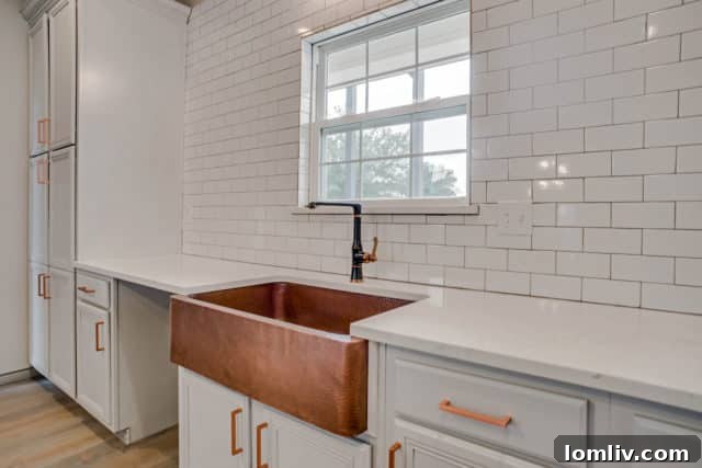 Close-up of the stylish copper sink in the gourmet kitchen of the renovated home