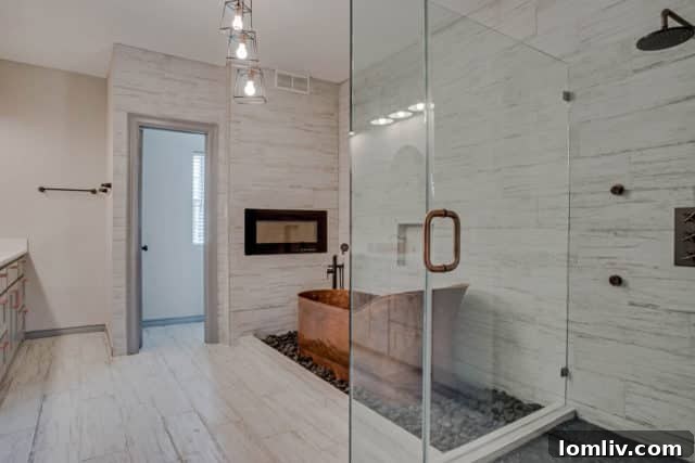 Luxurious master bathroom with a stunning copper tub and fireplace