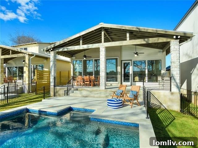 Luxury outdoor living area with pool and boathouse on Lake LBJ