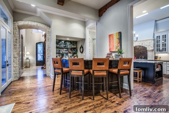 Spacious and elegant home office or study with rich wood finishes