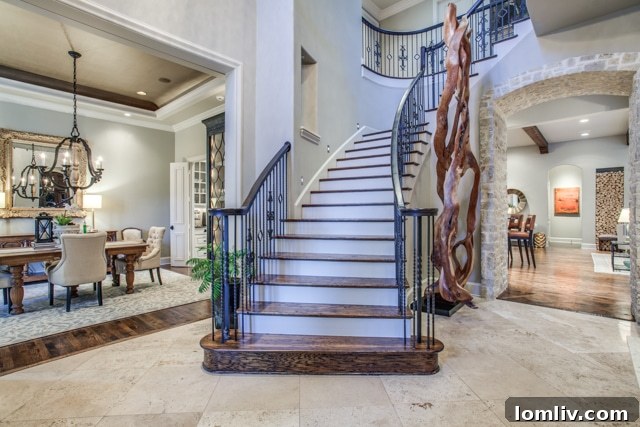 Gourmet kitchen with large granite island, high-end appliances, and elegant cabinetry