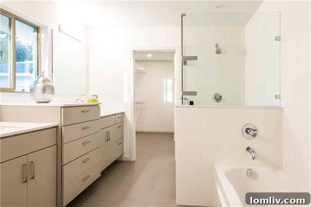 Elegant master bathroom with modern double vanity and stylish mirror