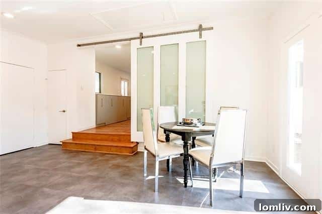 Multi-functional gallery room with modern barn doors and tiled flooring