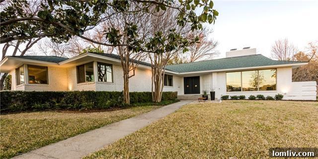 Architectural detail of the mid-century modern home entrance with oblique wings