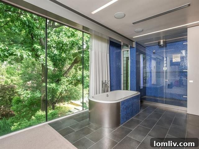 Expansive master bathroom with views of private gardens