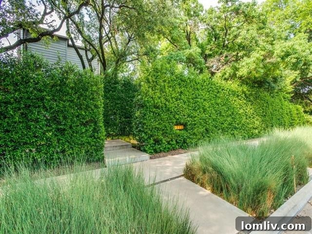 Secluded entrance of 3212 Dartmouth Avenue with tall hedges