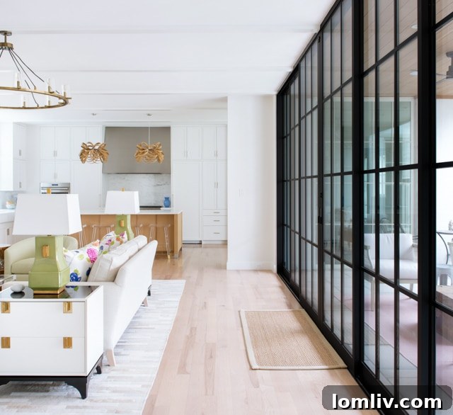 Floor-to-ceiling sliding glass doors connecting family room to patio.
