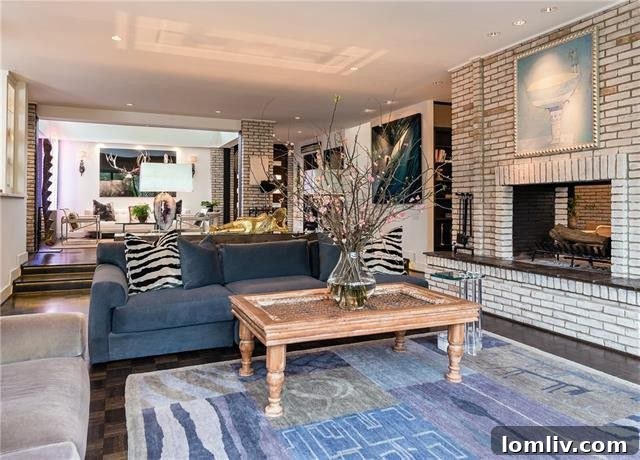 Expansive living area showcasing the open concept floor plan and connection to outdoor views