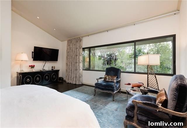 Overview of the living space from a different angle, emphasizing natural light