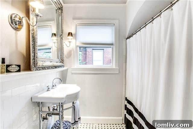 Totally Enchanted by This Hollywood Heights Tudor 18 Secondary Full Bathroom with Subway Tiles and Console Sink