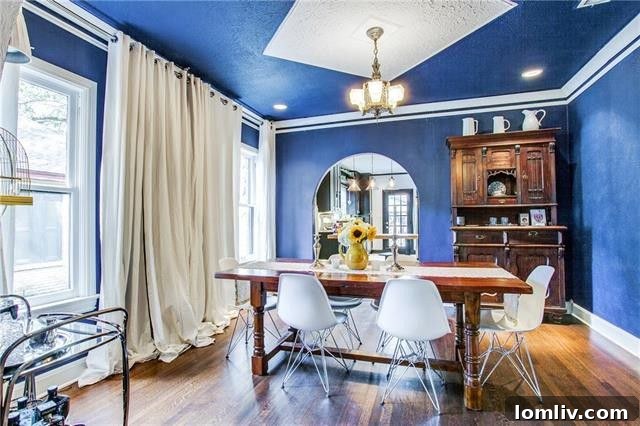 Totally Enchanted by This Hollywood Heights Tudor 7 Formal Dining Room with Regal Blue Walls and Archways in Dallas Tudor