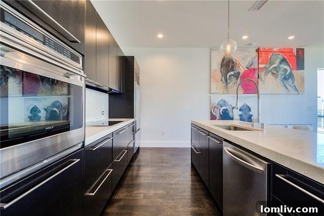 Kitchen details showcasing marble countertops and modern faucet