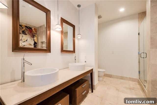 Soaking tub in a elegant bathroom with city views