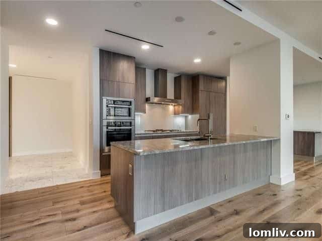 Dining area connected to kitchen with floor-to-ceiling windows