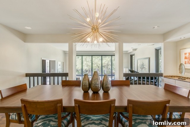 Elegant dining room overlooking the sunken living room, highlighting the split-level design at 4501 Overton Terrace Court