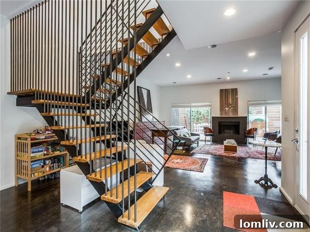 Spacious living area with abundant natural light, showcasing the industrial cable staircase