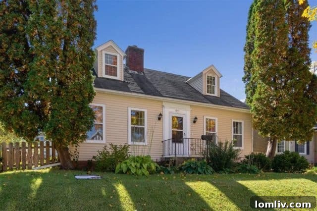 Charming small cottage with a well-maintained garden and welcoming front porch