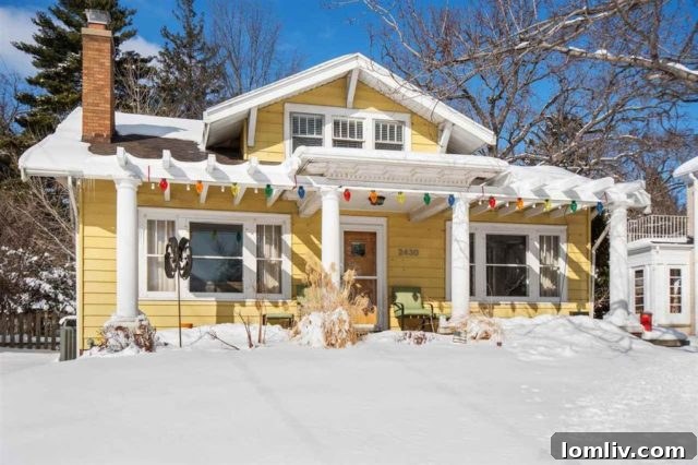 Classic 1922 Craftsman house with a distinctive front porch and mature trees