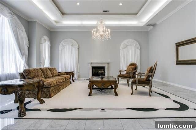 A spacious kitchen featuring a large central island and a modern gas cooktop, ideal for entertaining in the Abrams Road residence.