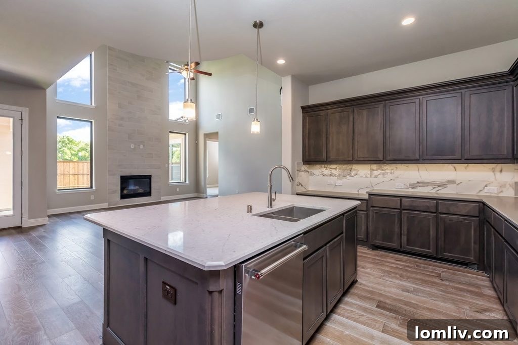 Spacious gourmet kitchen with large island and marble backsplash in a luxury home
