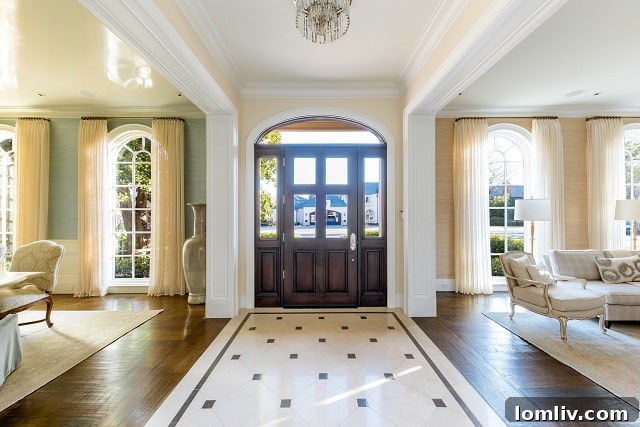 Grand Foyer with Elegant Chandelier and Staircase at 4304 Belclaire