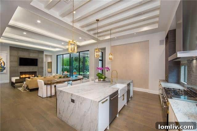 Elegant living room with a limestone wrapped fireplace and modern hearth at 4407 Pomona Road