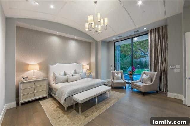 Luxurious master suite with an impressive barrel-vaulted ceiling and elegant decor