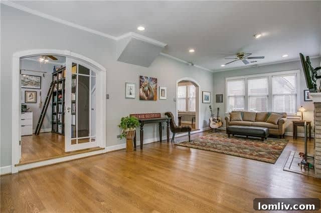 Inviting living room with classic Tudor features and ample natural light