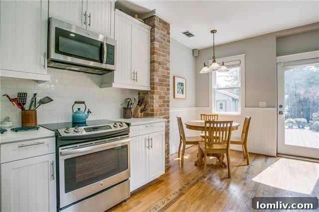 Modern kitchen with high-end appliances and custom cabinetry in a historic Tudor