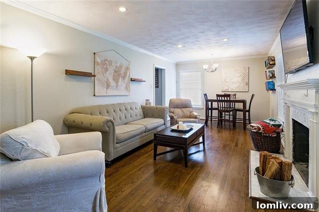 Bright living room with refinished hardwood floors in Dunhaven Road home